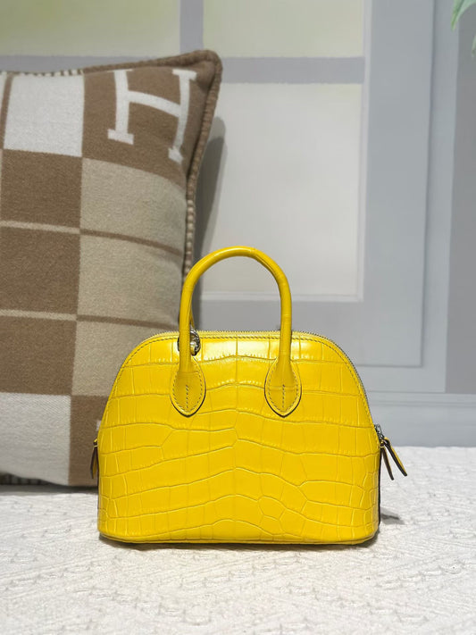 alt
Borsa mini bowling con manico superiore in vera pelle di coccodrillo gialla